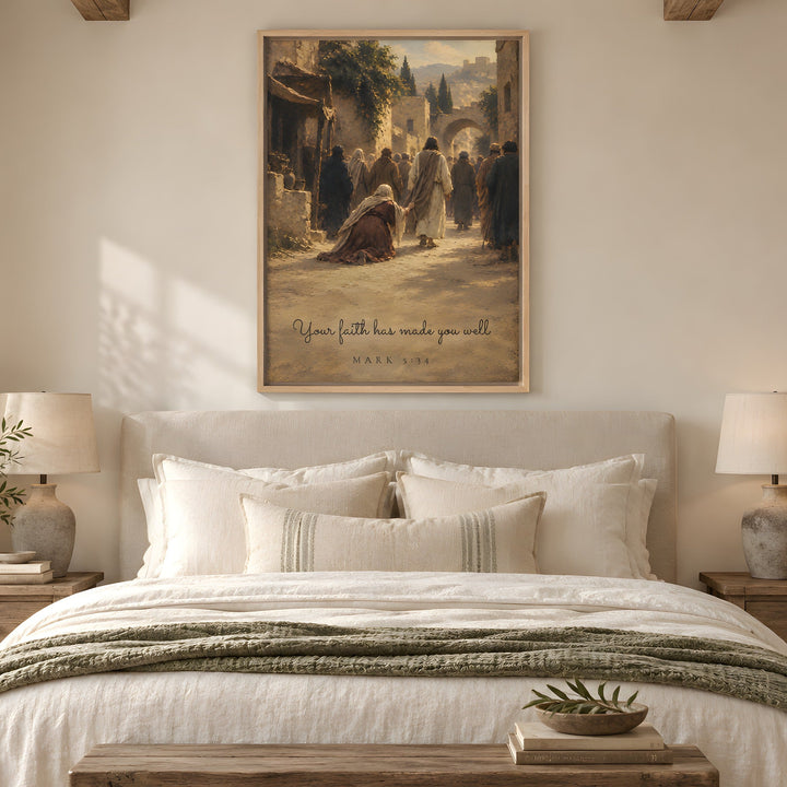 A framed art print featuring an ancient scene with the text 'If your faith has made you weak, MAN AS A TREE IS NOT NEEDED; SO FAR AS IS NEEDED, MAN WAS NOT NEEDED' from Hebrews 12:13, displayed on a neutral wall above a beautifully made bed in a warm, modern bedroom.