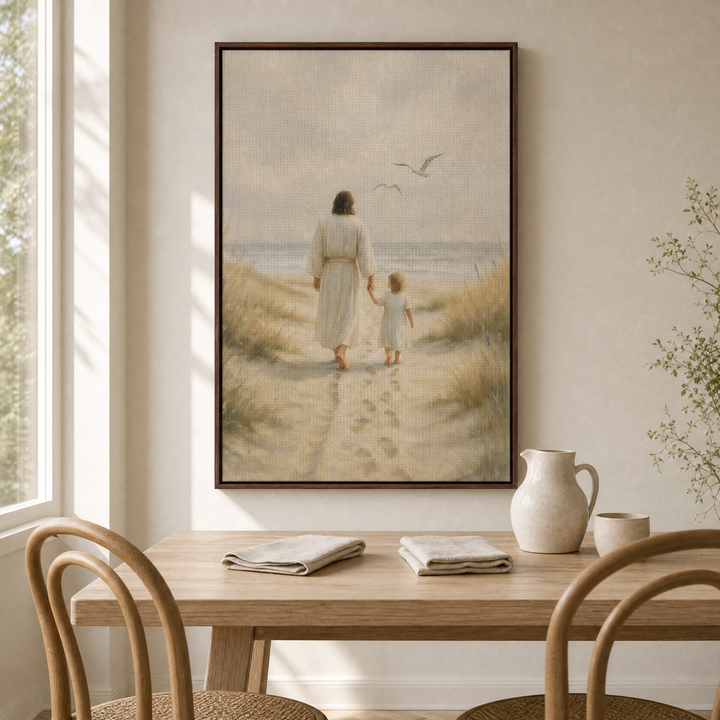 Jesus and Child framed canvas wall art above a light wood dining table in an airy dining nook