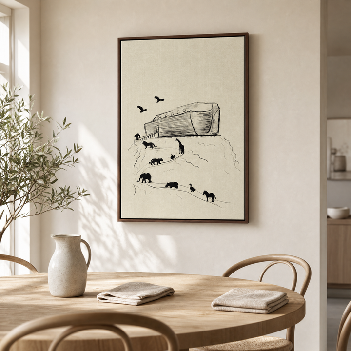 Noah's Ark framed canvas wall art above a light wood dining table in an airy dining nook
