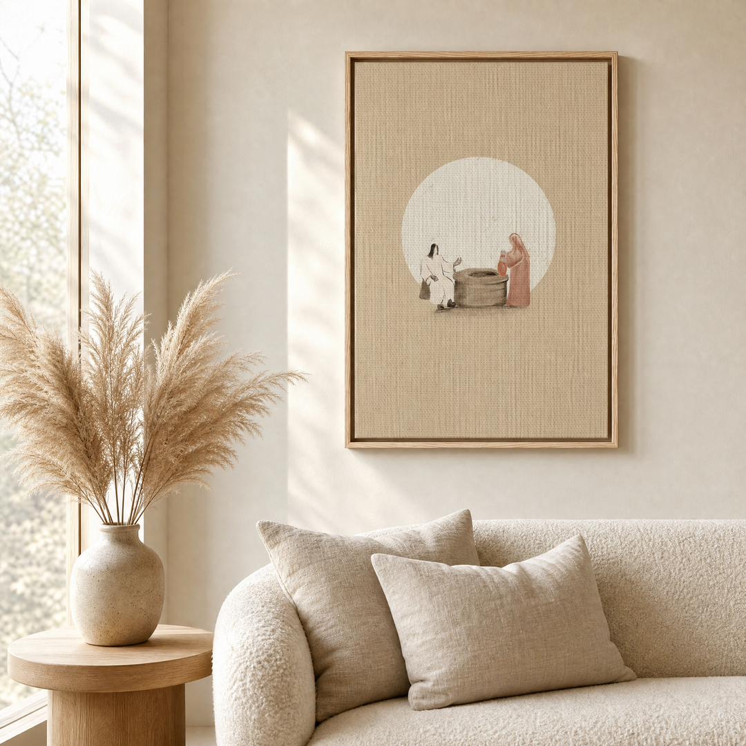 Woman at the Well framed canvas wall art styled above a beige boucle sofa in a warm living room