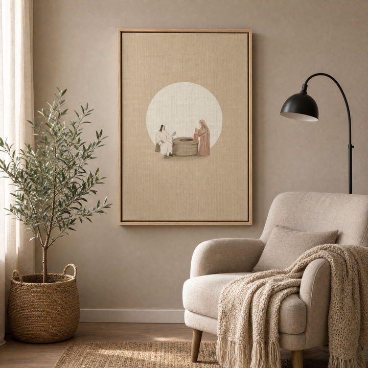 Woman at the Well framed canvas wall art in a cozy reading corner with a cream armchair and olive tree