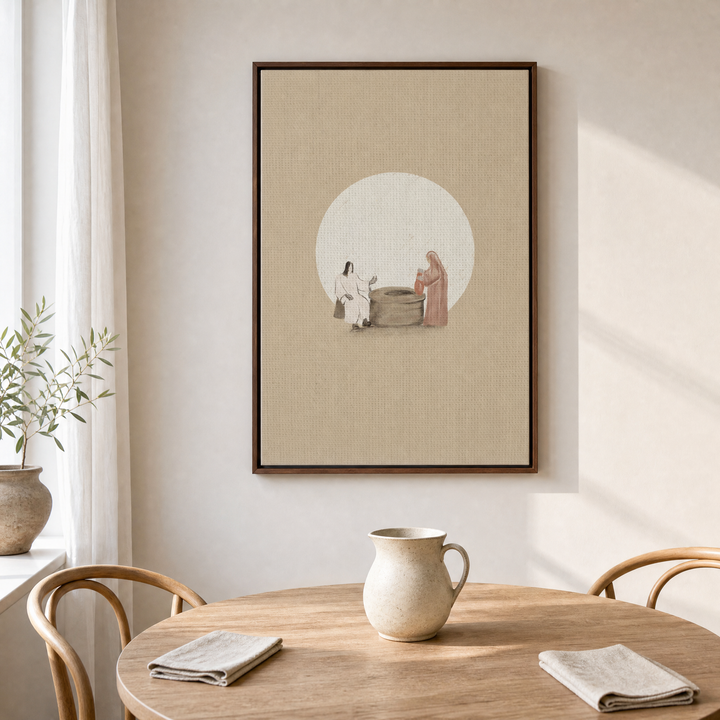 Woman at the Well framed canvas wall art above a light wood dining table in an airy dining nook
