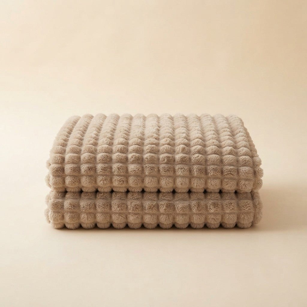 CloudHug bubble plush blanket folded in a stack